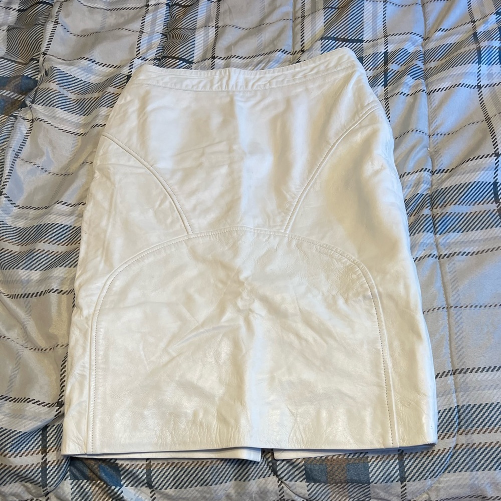 Custom designed white leather midi skirt.